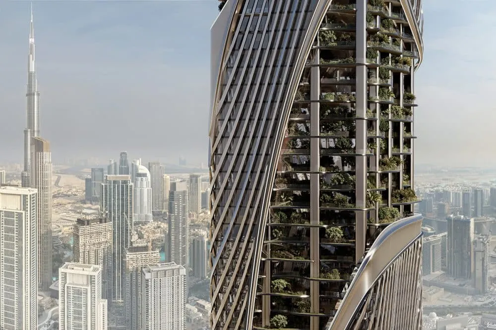 Render of the Christian A. Rockefeller Business Tower: a curved, ribbed glass facade with planted terraces, with the Burj Khalifa behind